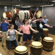 Group learning taiko drumming in Tokyo