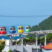 Cute and colorful little trams are lined up in Haundae's Blue Park in Busan, South Korea
