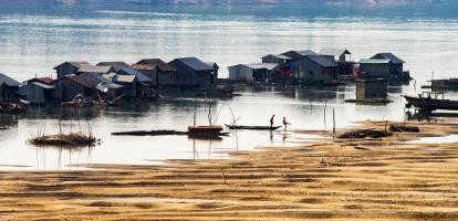 Fishing boats and traditional floating village at Kratie