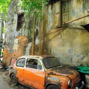 Orange vintage car street art on wall in Talad Noi, Bangkok