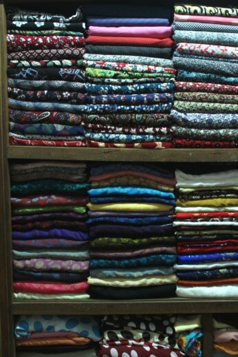 Stacked silk at a Hoi An tailor shop
