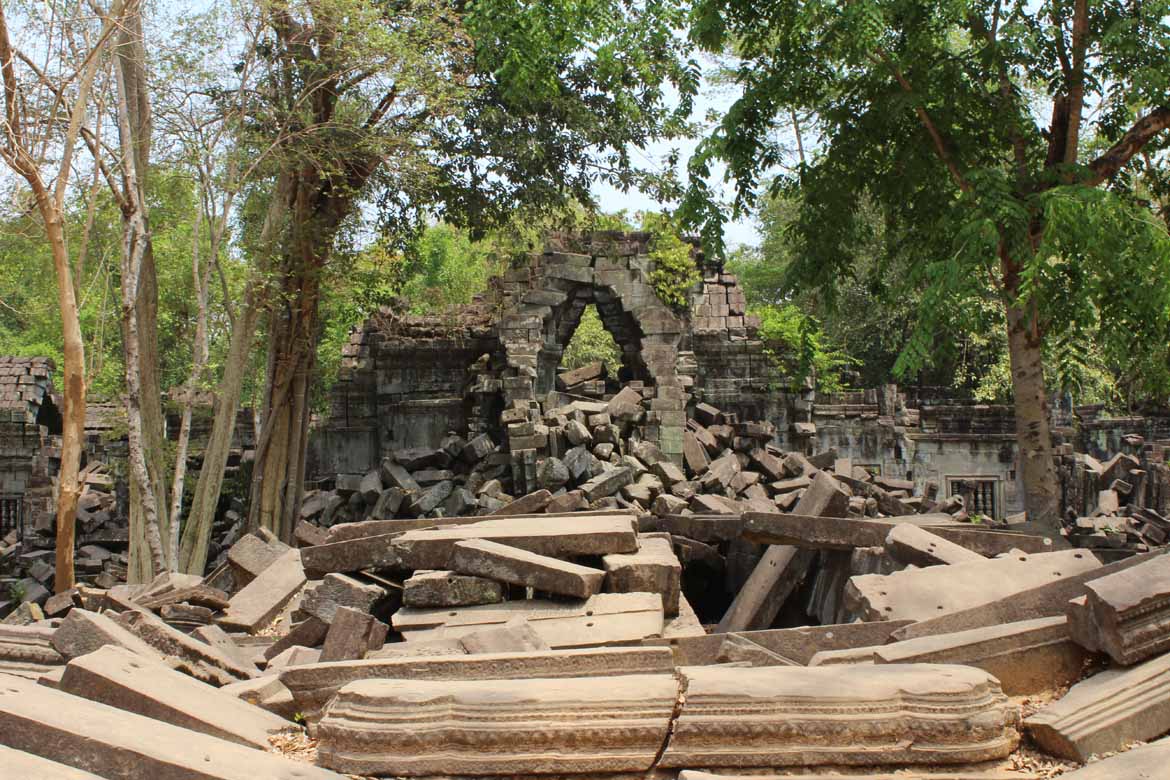 Beng Mealea lies partially subsumed by jungle