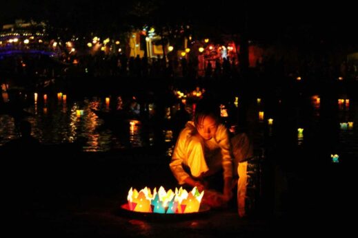 Casting lanterns on the river at Hoi An Lantern Festival