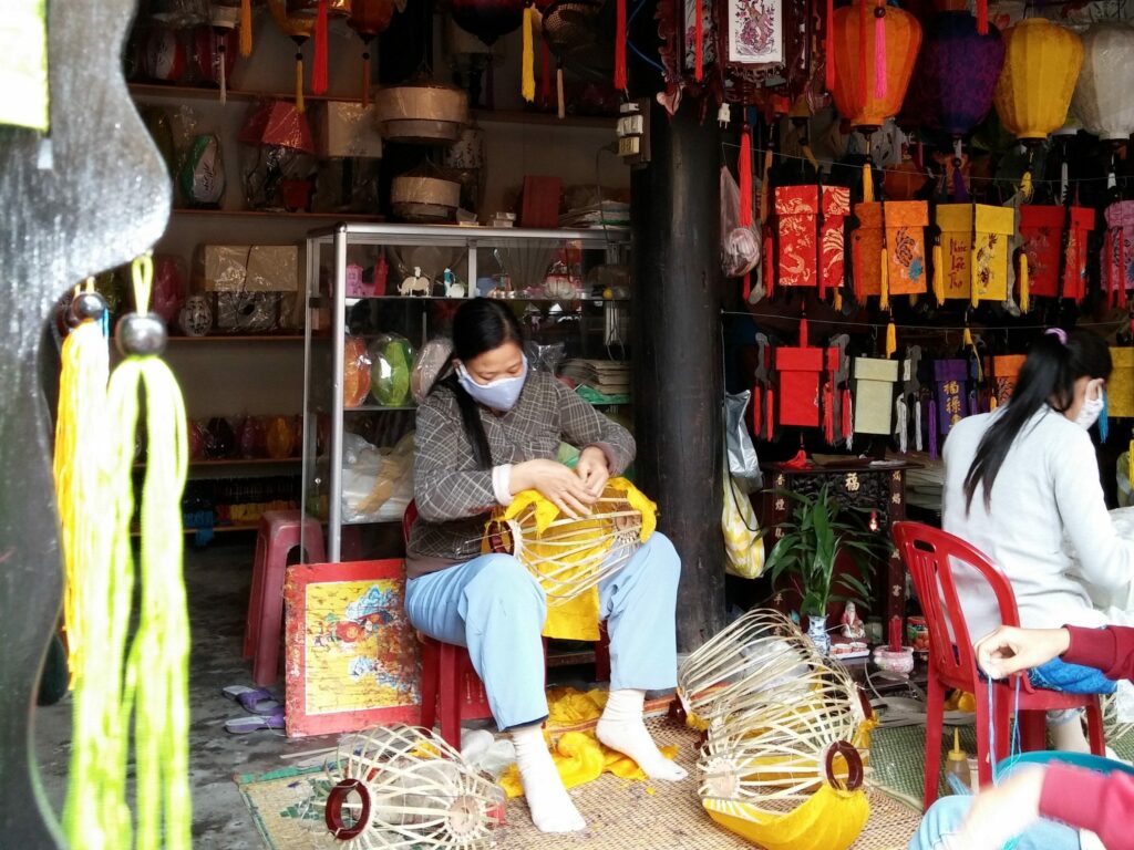 Vietnamese lady making paper lanters