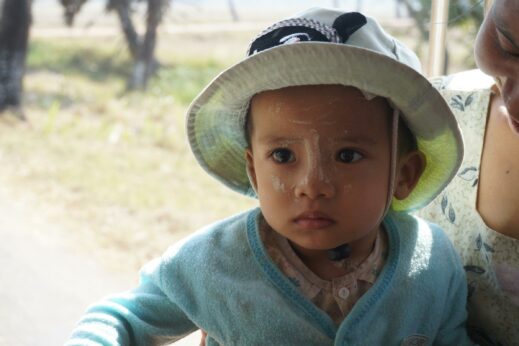 Child in a sun hat on Ogre Island, Burma (Myanmar)