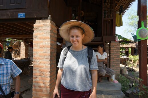 Becky wearing a sun hat and a longyi in Burma (Myanmar)