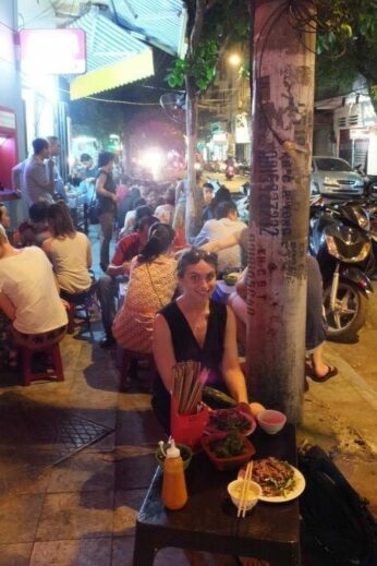 Claire sitting down for pho after 24 hours in Hanoi