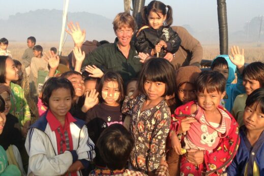 Ali in hot air balloon with local children in Burma