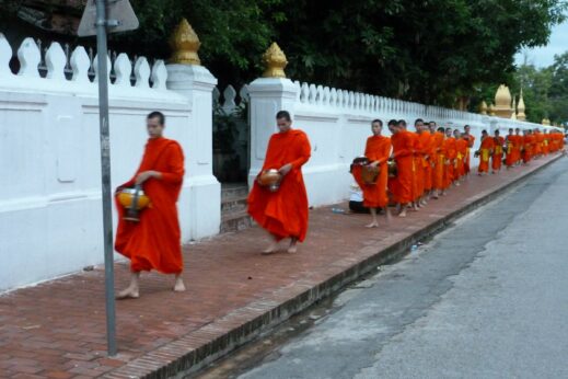 Monks in orange robes in Luang Prabang, Laos