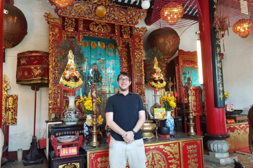 Dylan at a Chinese temple - Solo travel in Vietnam
