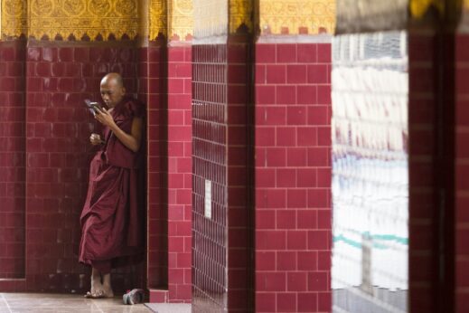 A monk uses his mobile phone in Burma
