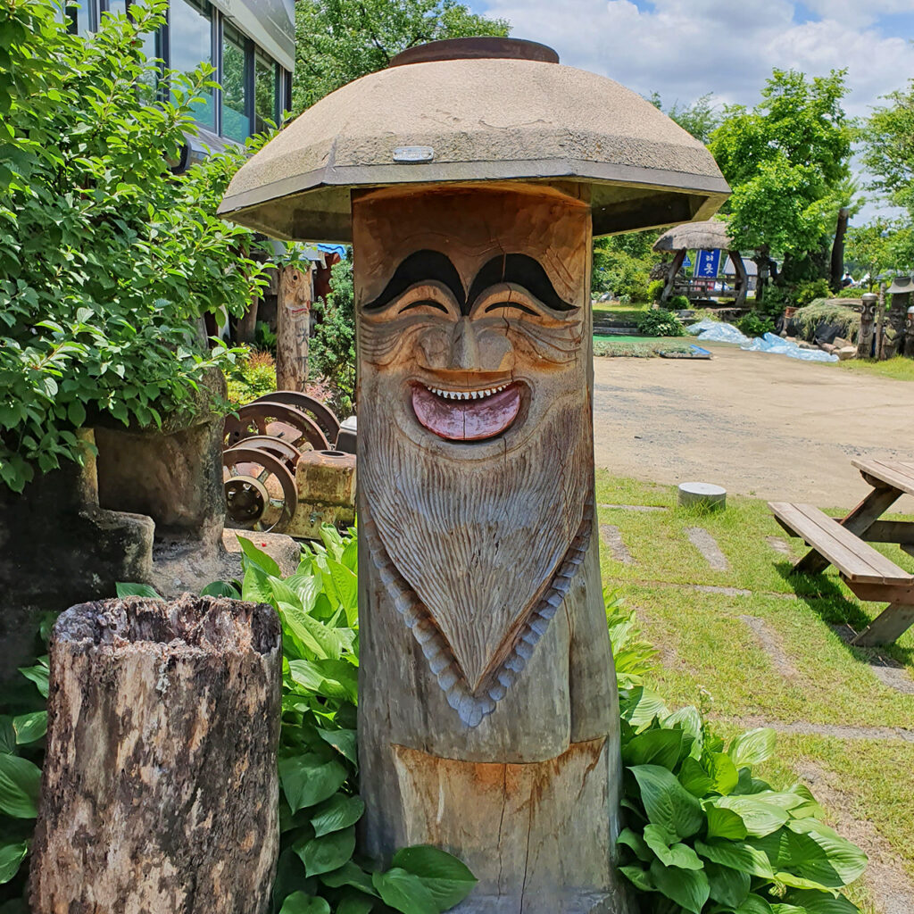 A traditional wooden sculpture with a smile in South Korea, called a Jangseung