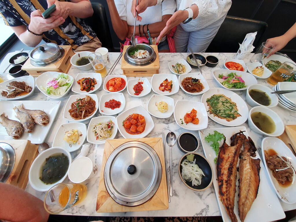 An assortment of side dishes are displayed on a table in South Korea, also known as banchan