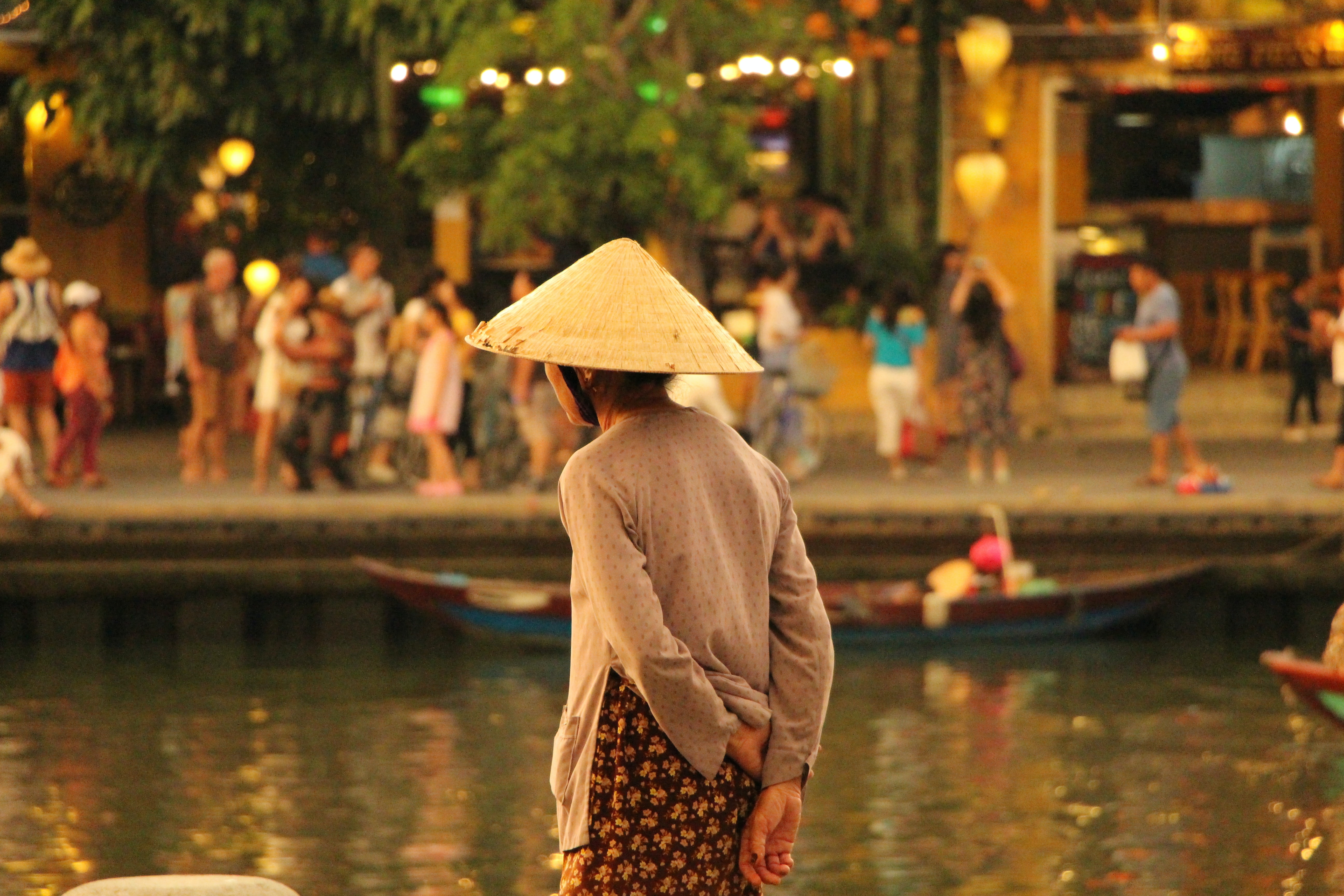 A woman in a conical hat in Hoi An
