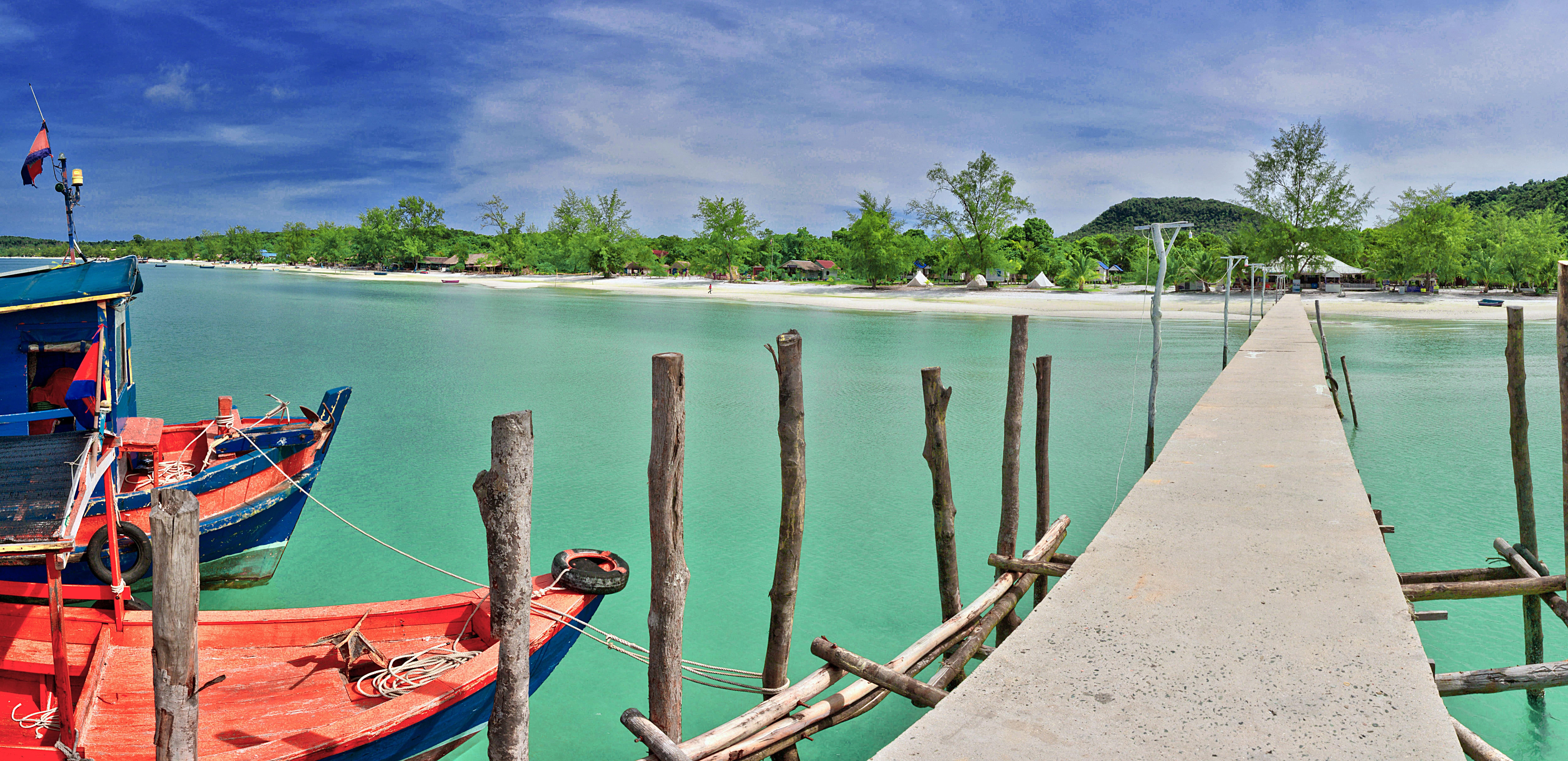 A wooden pier over turquoise water in Koh Rong