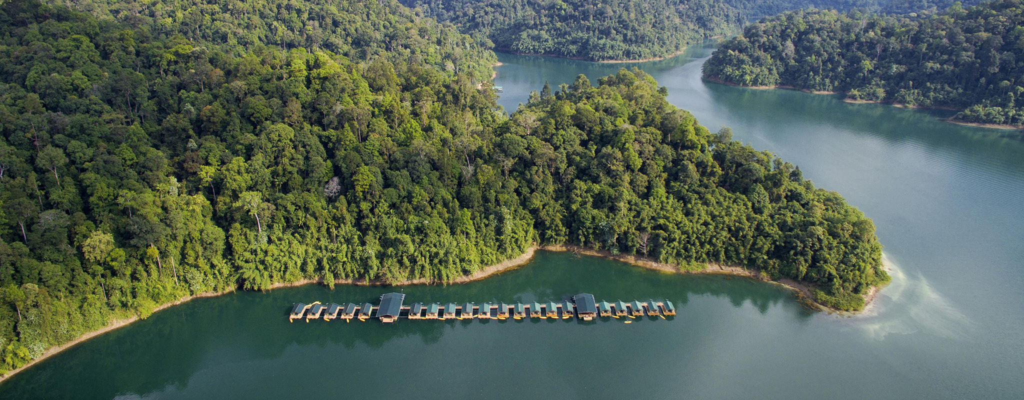 PLACE HERO - Khao Sok National Park - Camp Cheow - Larn Lake © ELEPHANT HILLS cropped Overwater bungalows next to lush outcrop of land in Khao Sok National Park