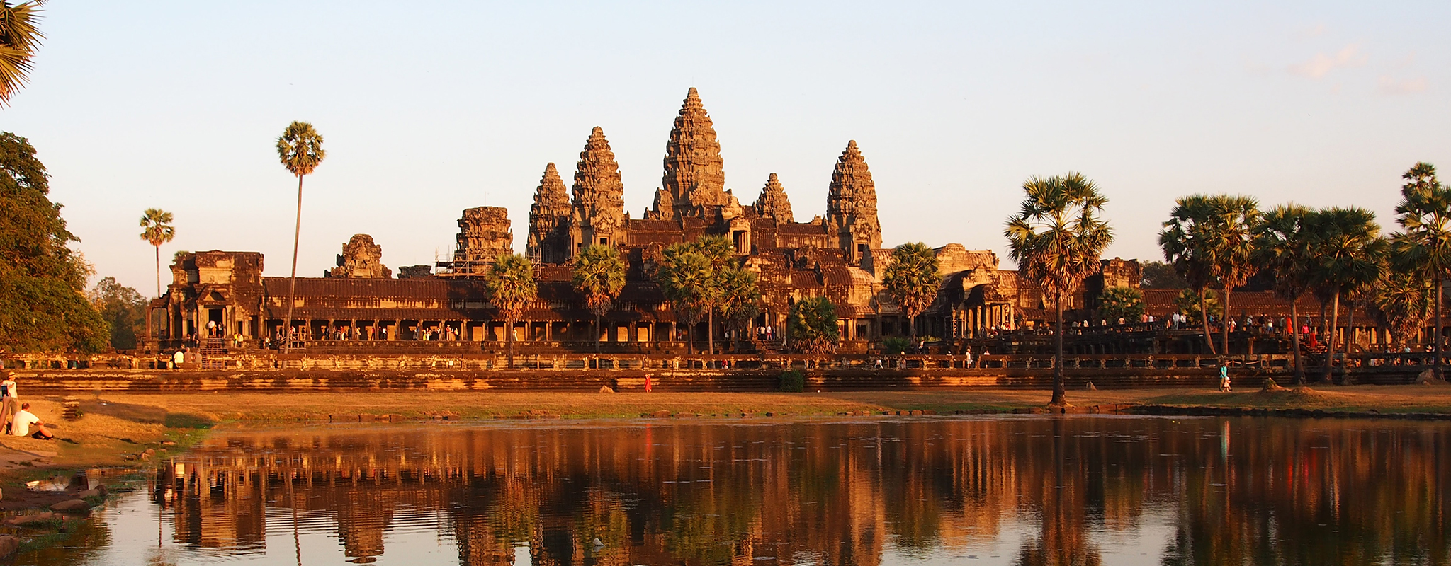 Cambodia-Siem-Reap-Sunrise-Hero .jpg Early morning sun in Angkor Wat temple, with reflections showing on the lake