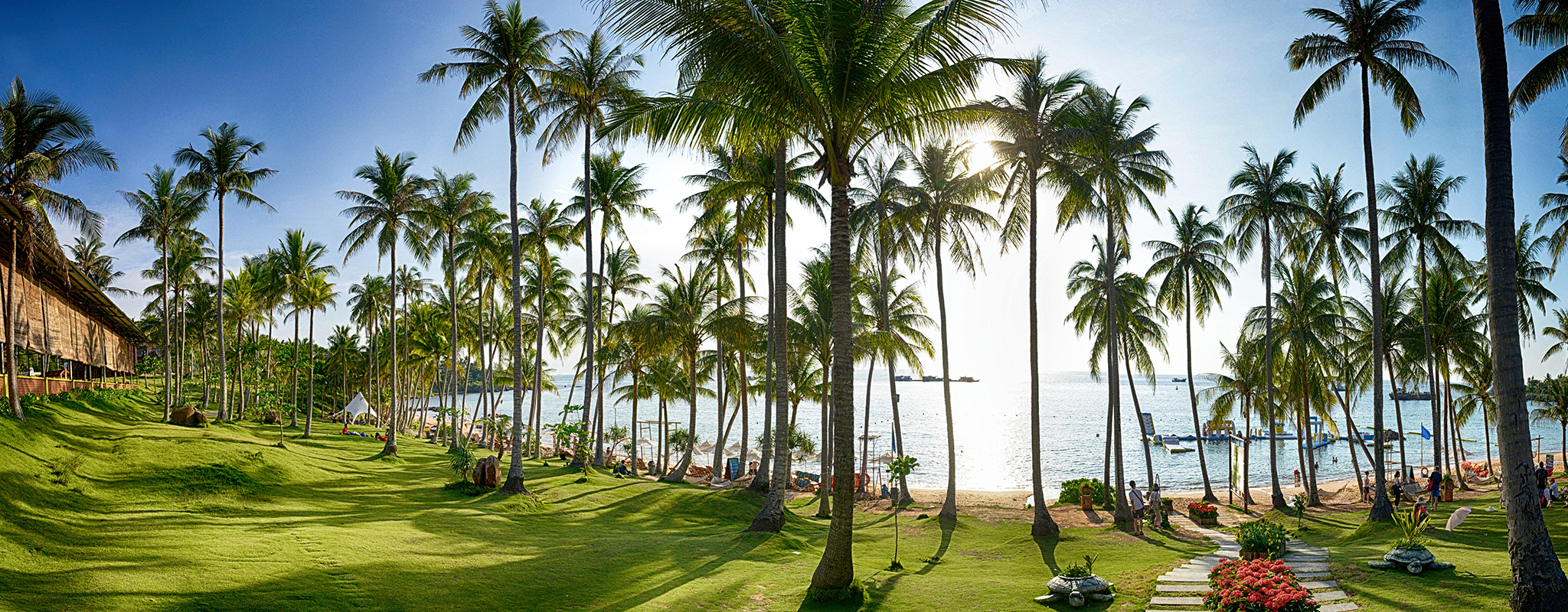 Beautiful-Phu-Quoc-Beach-Vietnam Stunning colors in Phu Quoc beach, with grass and palm trees on foreground