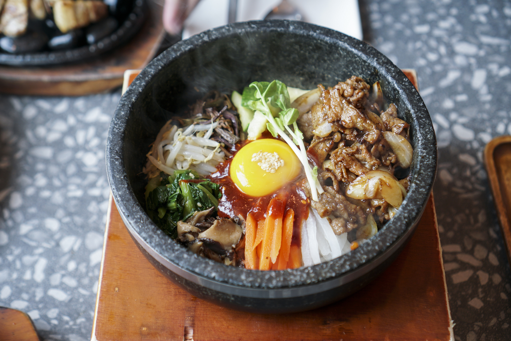 Bibimbap_iStock-1210909876_Swanya Charoonwatana.jpg Bowl of vegetables, meat and egg