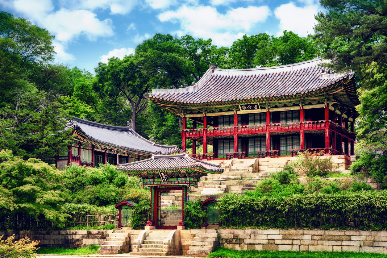Changdeokgung-Palace-Seoul_iStock-1266597541_GoranQ.jpg Ornate temple surrounded by trees
