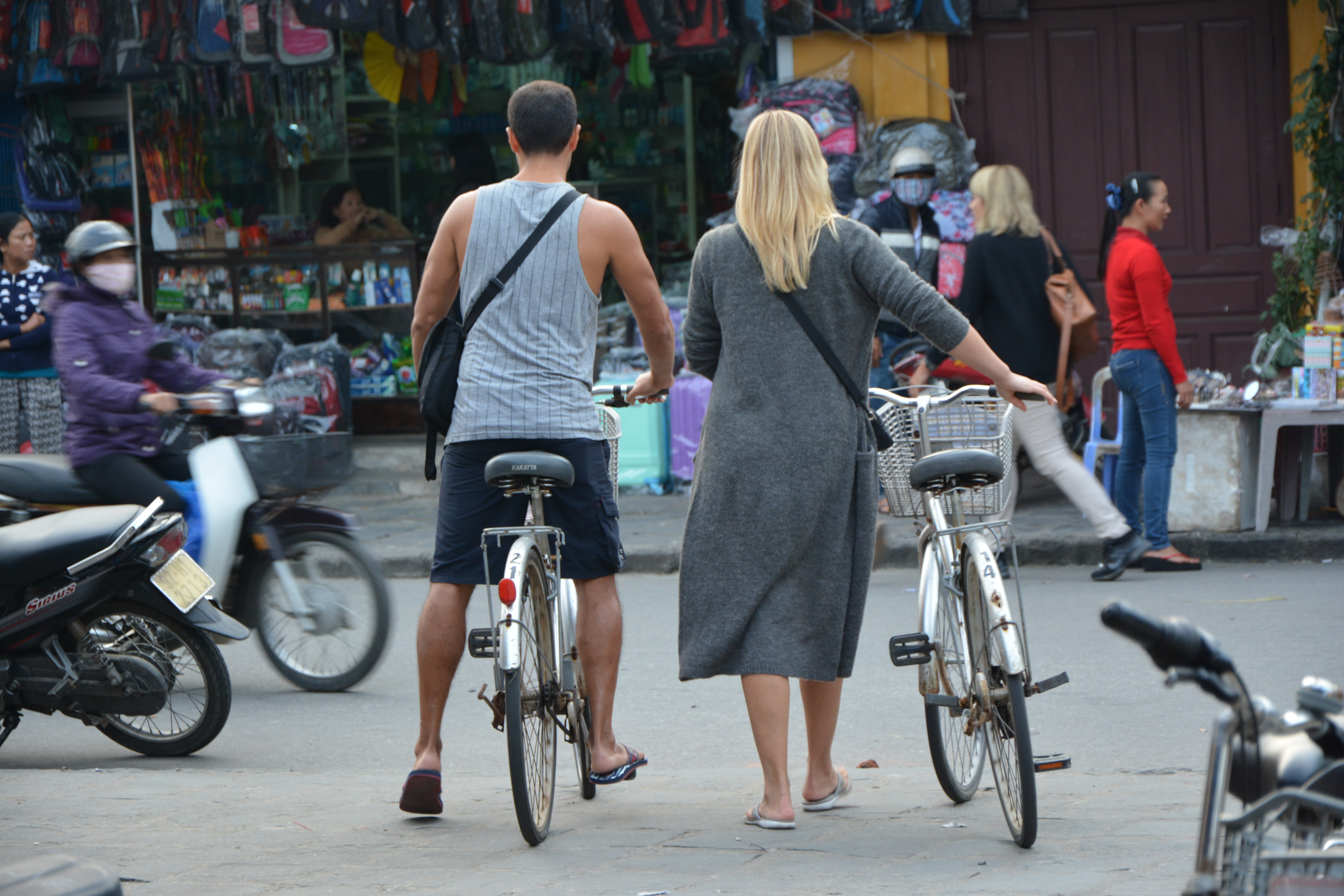 Couple-bike-Vietnam.jpg Couple pushing bicycles across busy road in Vietnam