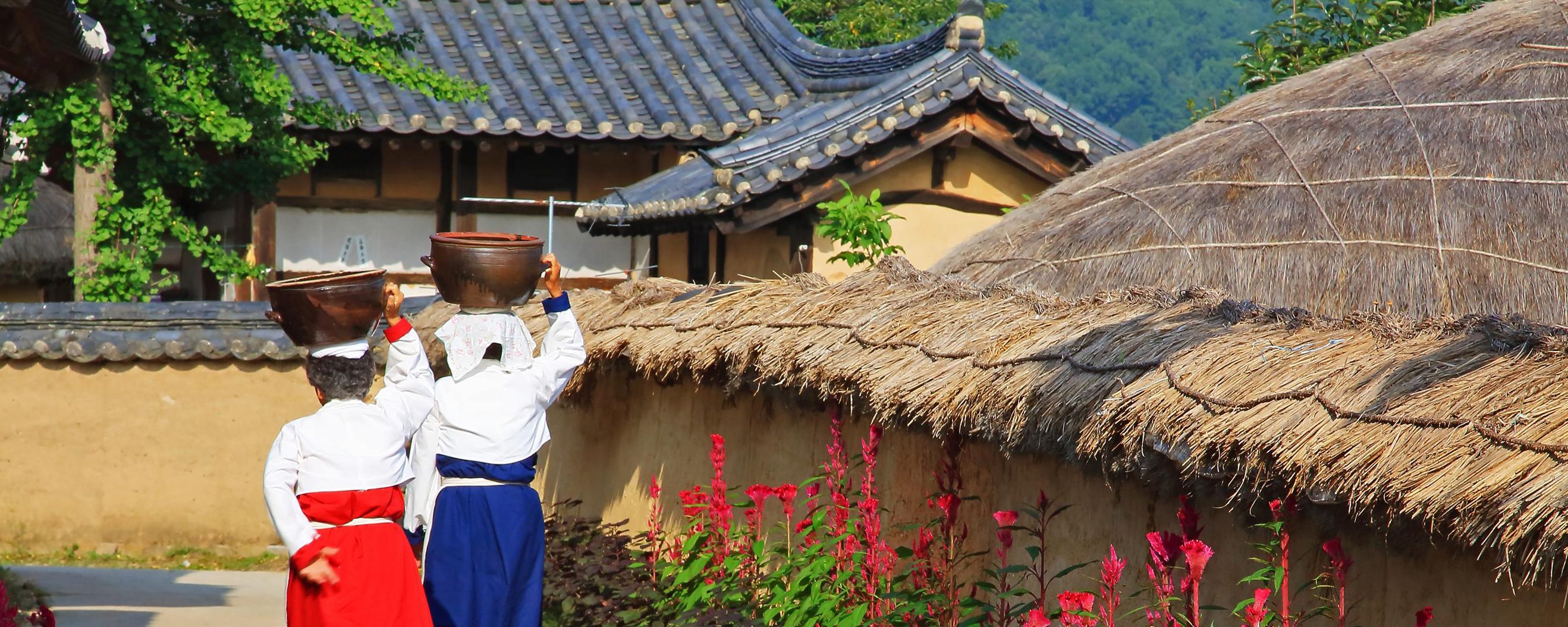 Hahoe-Folk-Village-Andong-South-Korea-hero.jpg People in traditional dress walking through Hahoe Folk Village