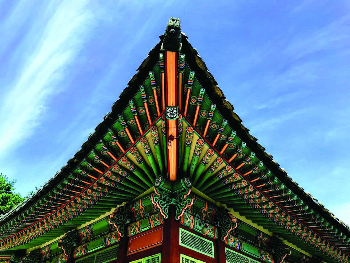 Pointed edge of ornate temple rooftop