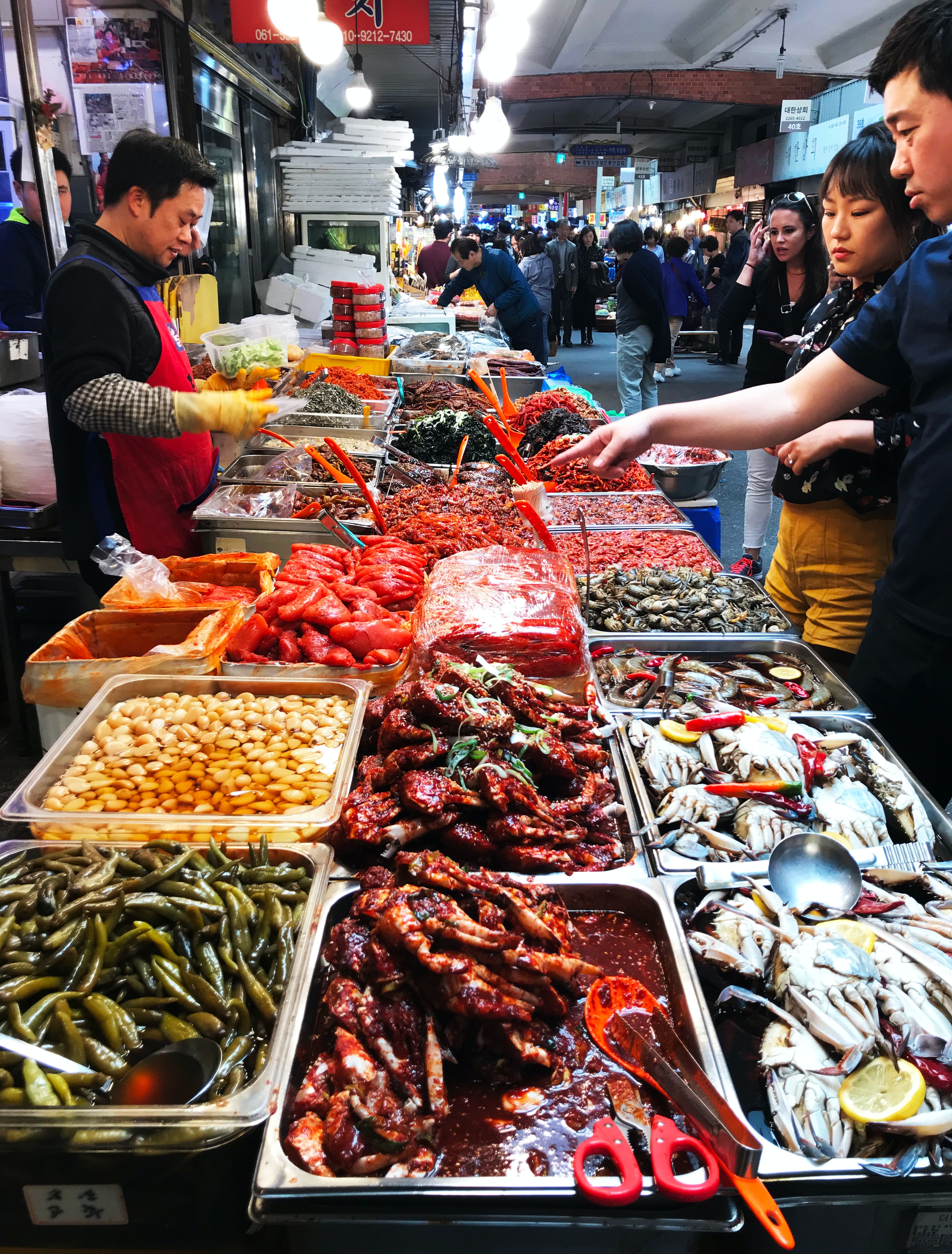 Seoul-food-market.jpg Customers selecting spices at a food market in Seoul