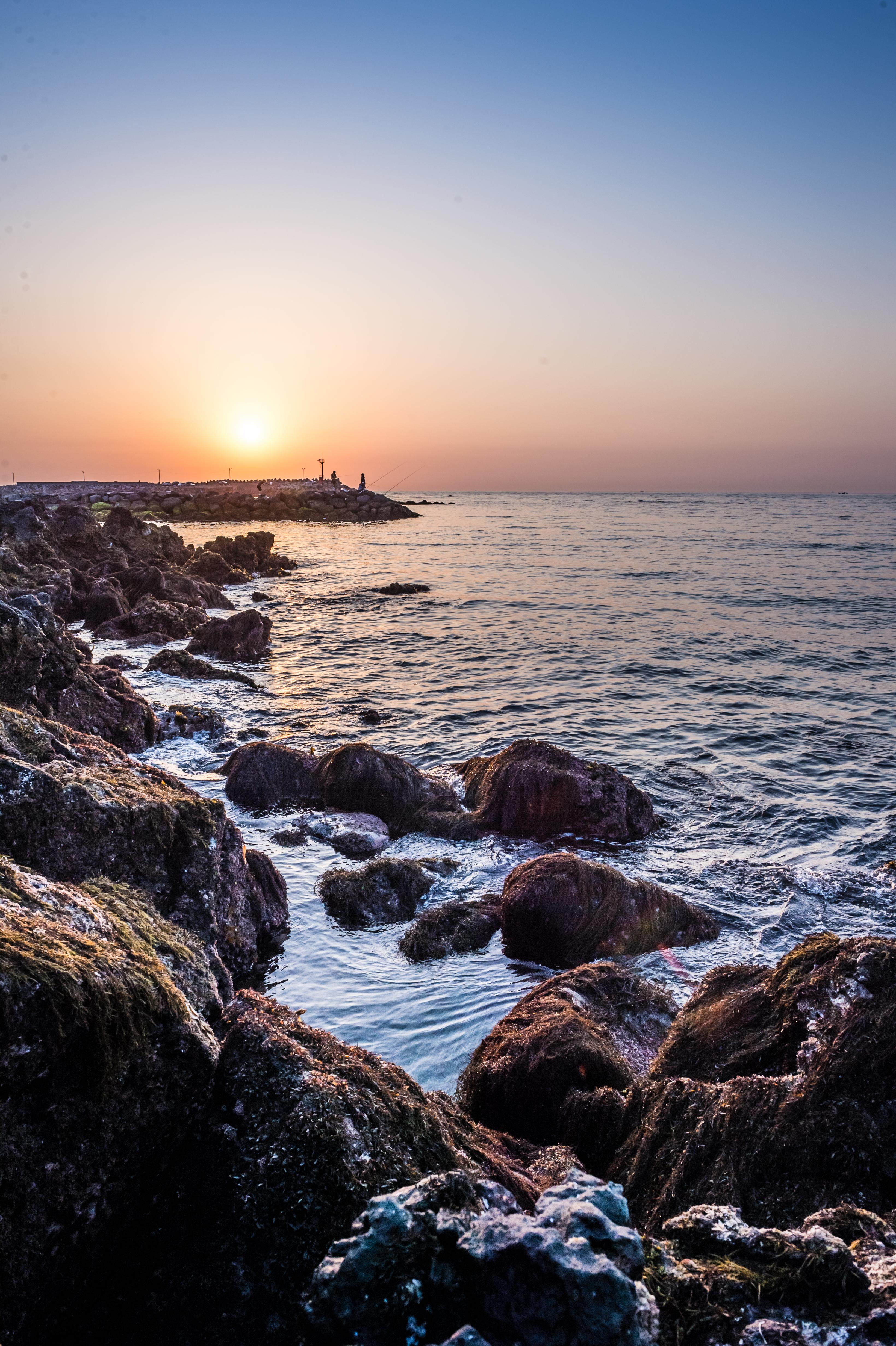 Sunrise-over-Jeju-Island.jpg Sunrise over rocky pier in Jeju Island