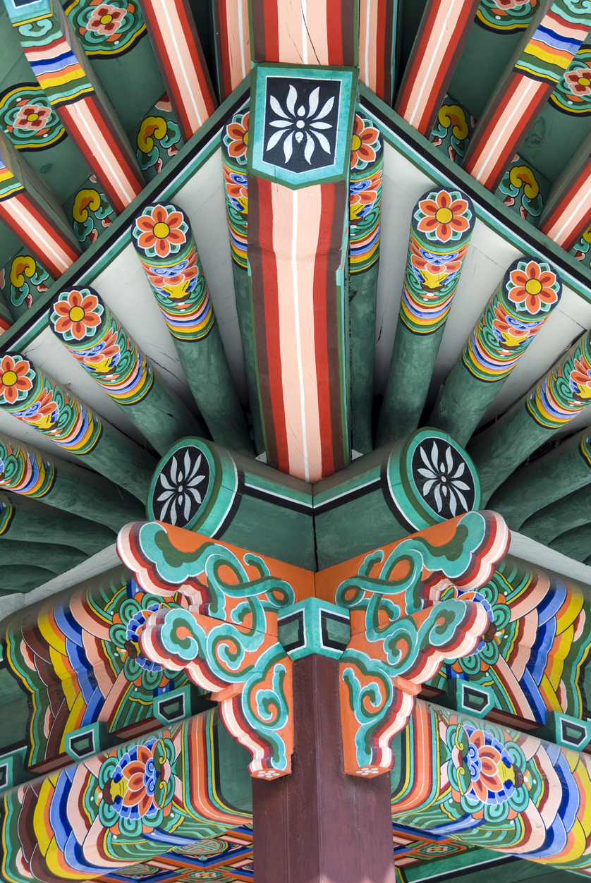 Brightly coloured decorative edge of temple roof