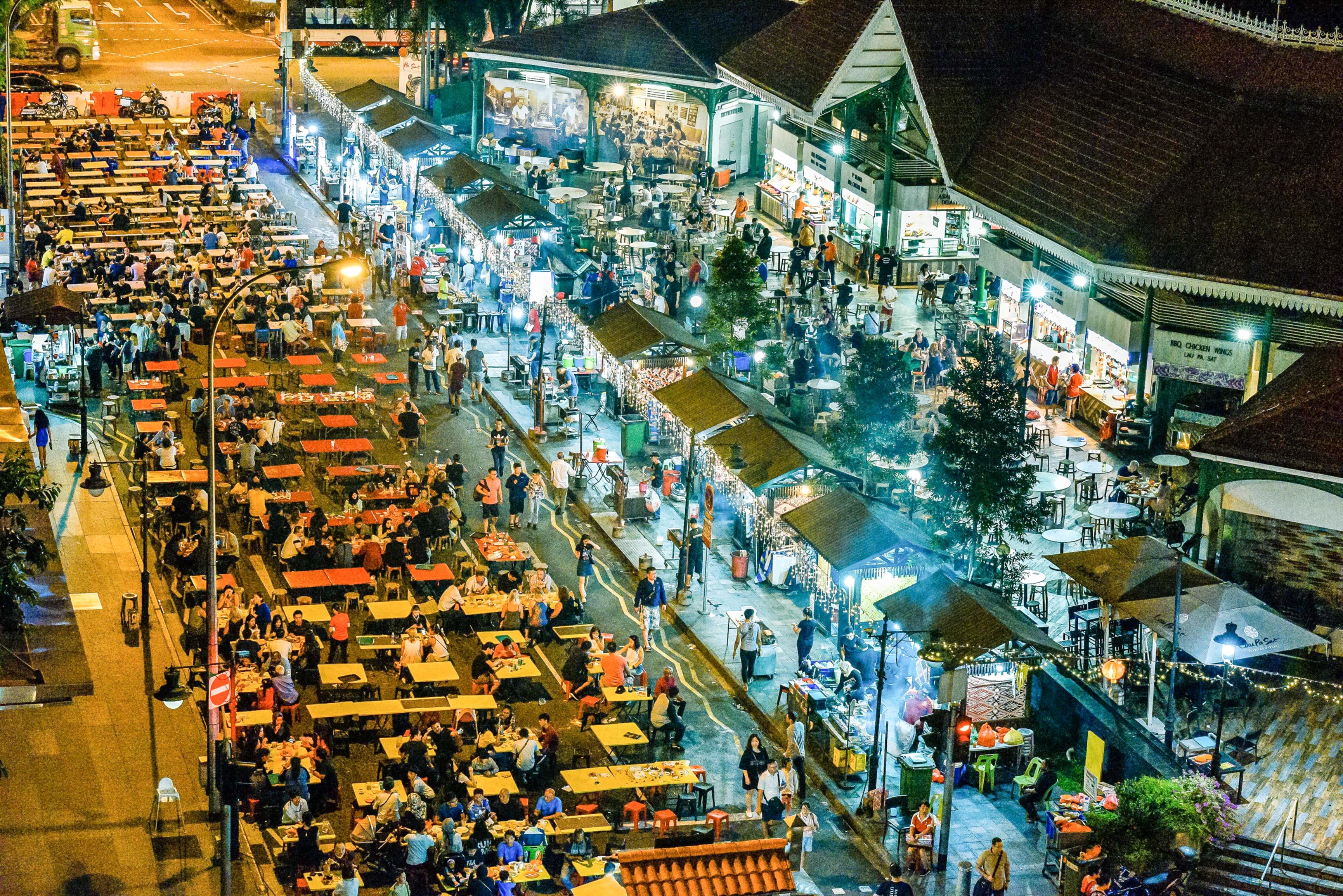 Aerial view of people eating at outside tables at Hawker Centre
