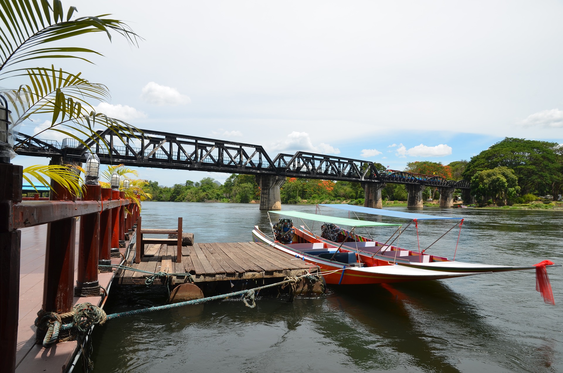 Bridge-River-Kwai.jpg Boats at jetty in front of bridge over River Kwai