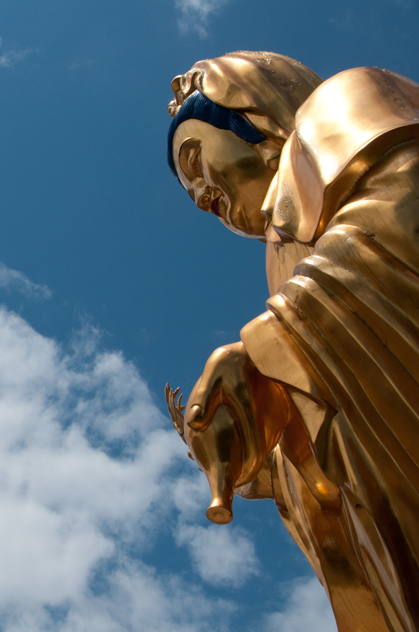 Buddha statue in Sha Tin cemetery.jpg Golden Buddha statue with sky in background