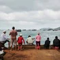 Vietnamese people fishing at a harbour in Con Dao