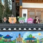 Two staff members with cute characters