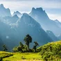 Mountain and blue sky at Kasi, Laos. and little home in grass field in front of mountain