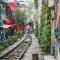 Walking along the railway tracks in the back streets of Hanoi