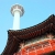 Red temple roof and Busan Tower in background