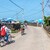 Two people cycling along a quiet street in Udo Island