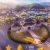 Aerial view of ornate building in middle of roundabout 