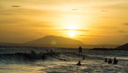 Surfing at sunset in Mui Ne