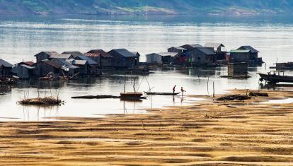 Fishing boats and traditional floating village at Kratie