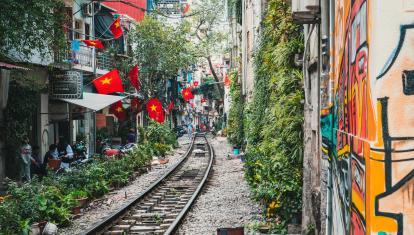 Walking along the railway tracks in the back streets of Hanoi