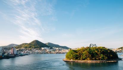 Warm sunset falls over island and the city of Yeosu, in southwest South Korea