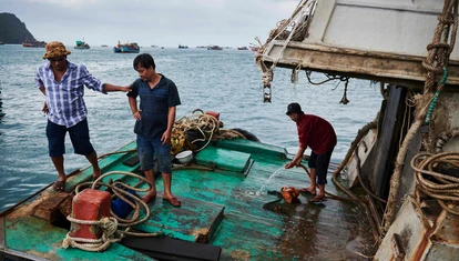 Locals of Con Dao on fishing boat