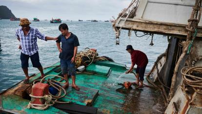 Locals of Con Dao on fishing boat