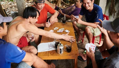 Local Con Dao men playing cards