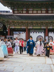 Seoul palace in November with people wearing traditional hanbok 