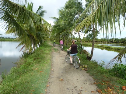 Cycling along the banks of the Thu Bon River near Hoi An