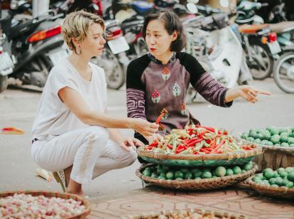 Chef Ai running a market tour in Vietnam
